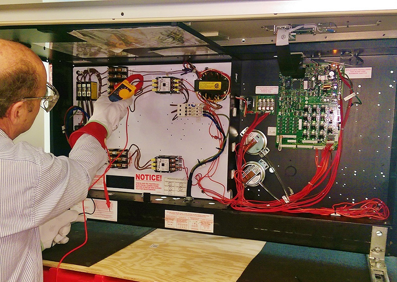 Here a student learns proper technique and safety precautions while taking amp readings on our fully functional and modular computer room air conditioning (CRAC) unit.